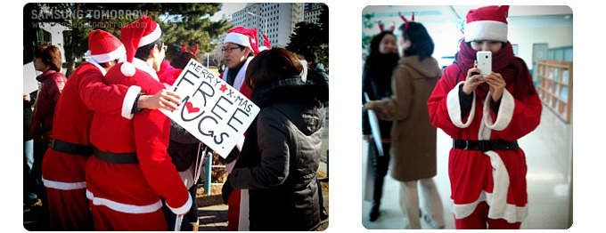 서로 안고있는 산타복장을 한 사람들