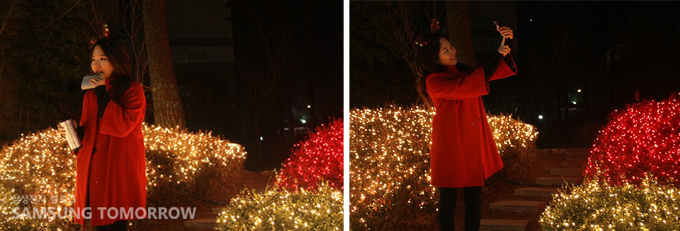 크리스마스 전구앞에서 사진찍는 스토리텔러